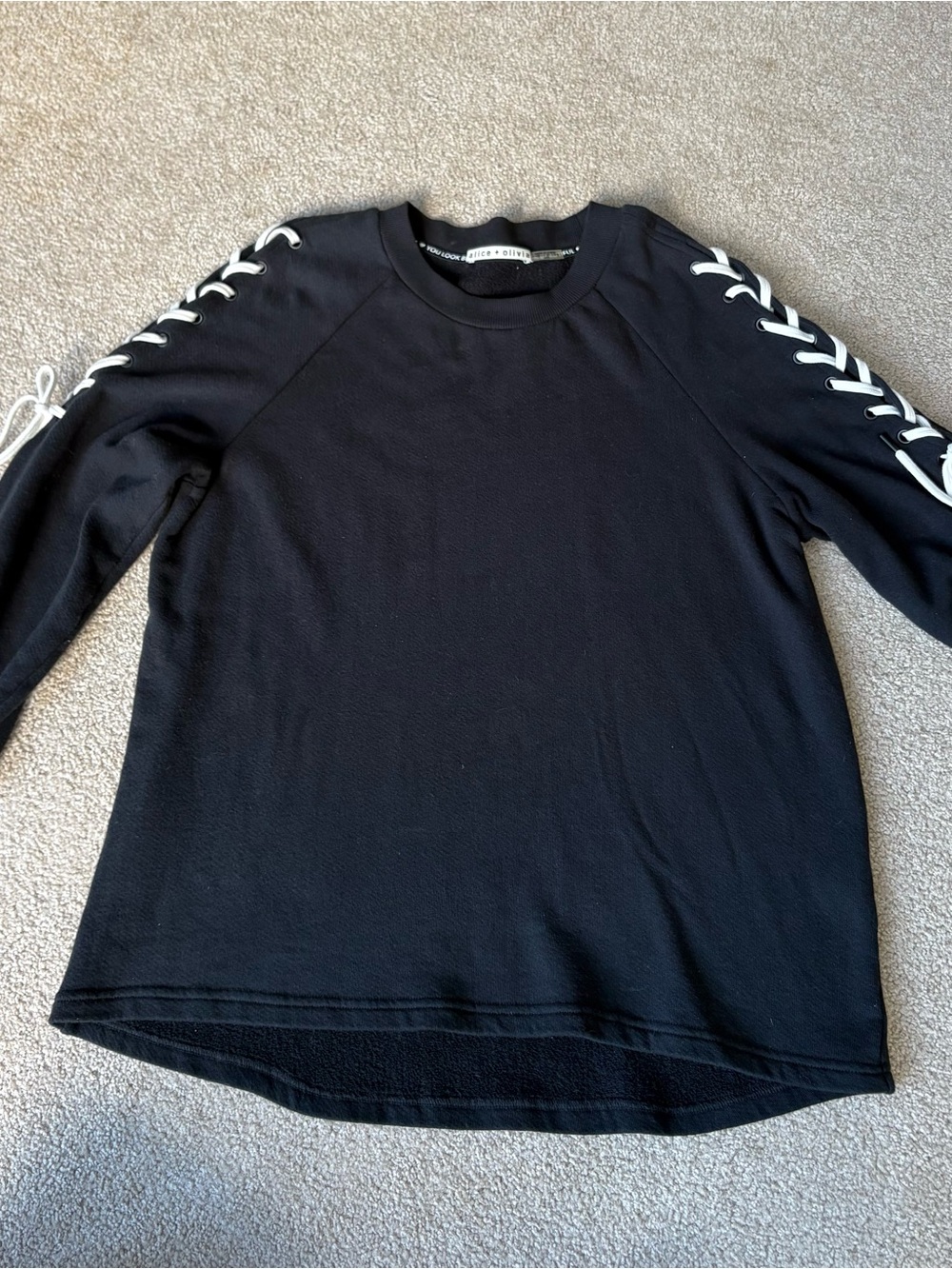 Alice + Olivia Black Crewneck Sweater with White Lace-Up Sleeve Detail